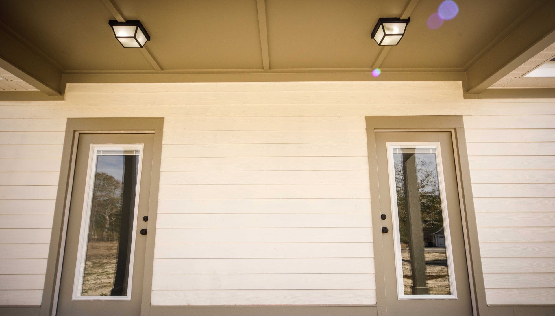We offer siding services in Normal, Illinois. Hardie plank siding installation in a front entry way.